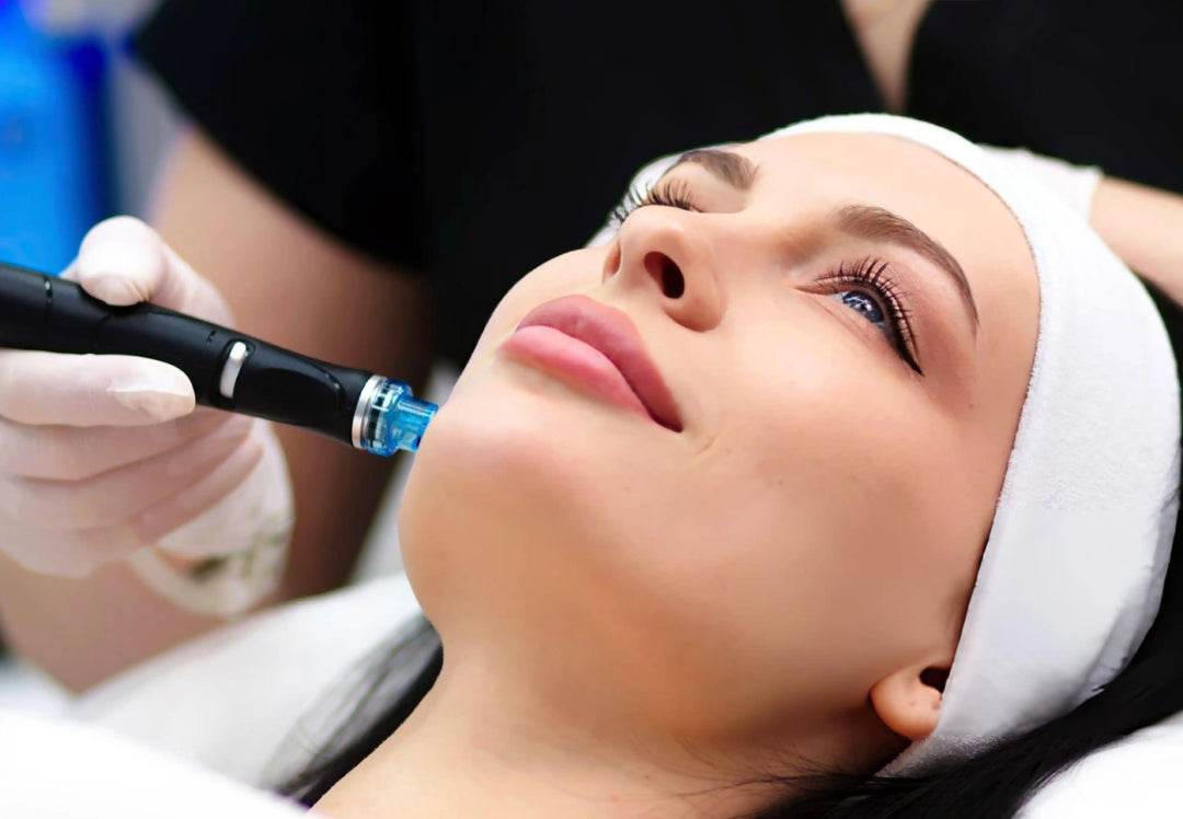 Anti-aging care, skin care, facial cleansing. A cosmetologist does a hydrofacial procedure on a woman's face at home