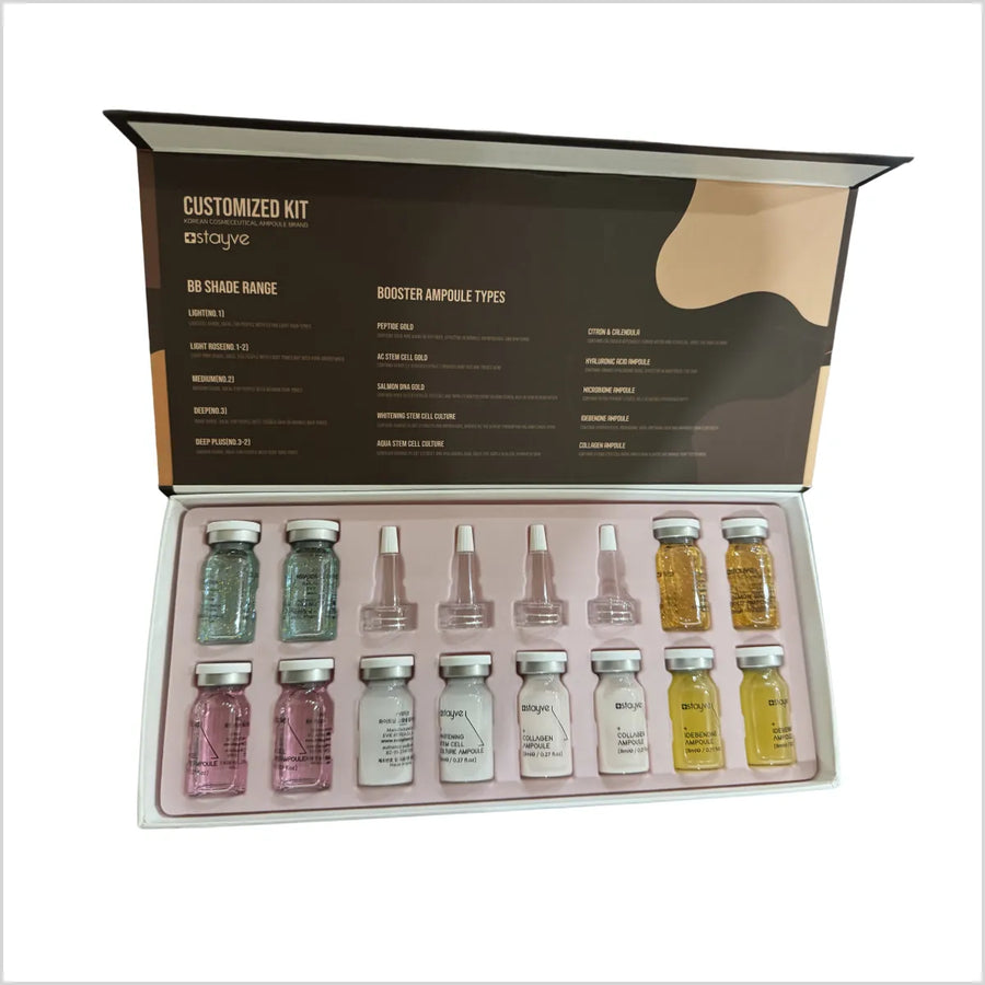 Skincare ampoules set with a branded box on a white background