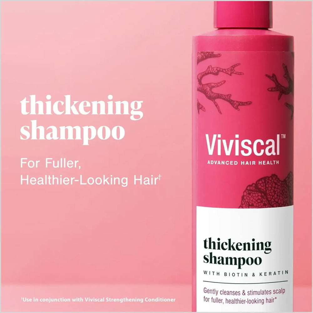 Viviscal thickening shampoo bottle on a pink background