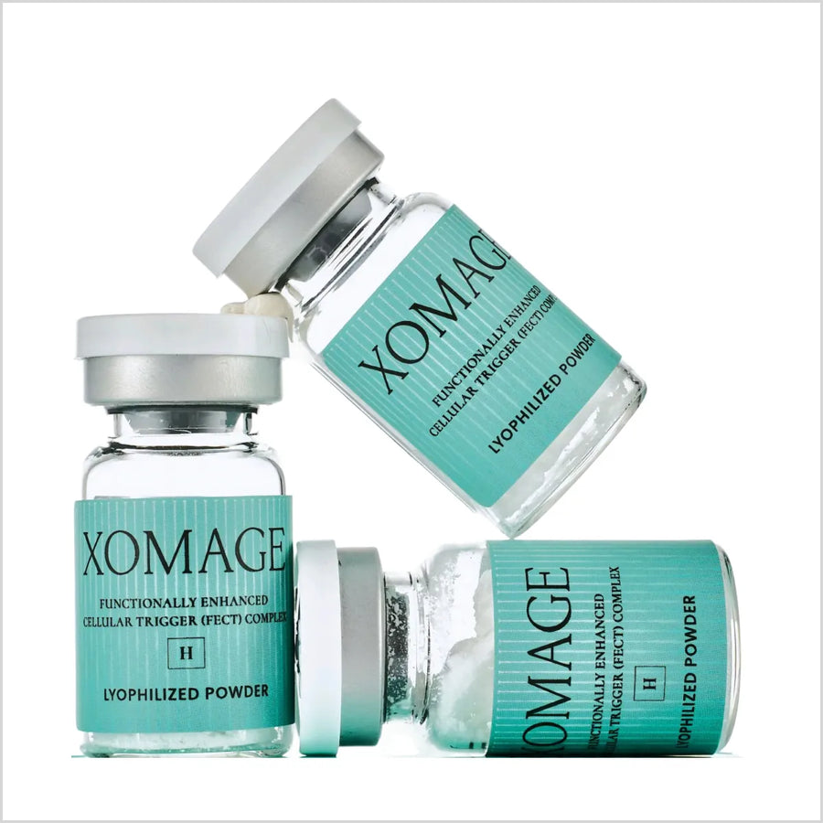 Three vials of XOMAGE lyophilized powder on a white background - Skinae.pk